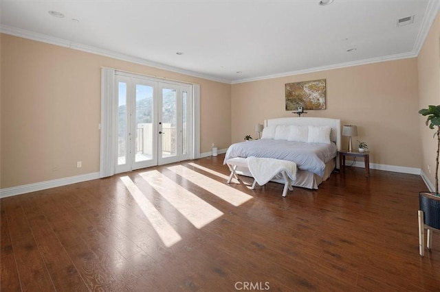 bedroom featuring dark hardwood / wood-style flooring, access to exterior, and crown molding