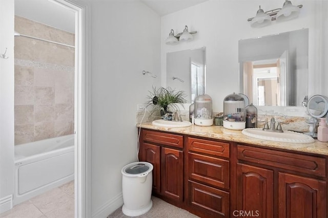 full bathroom featuring double vanity, tile patterned floors, shower / tub combination, and a sink