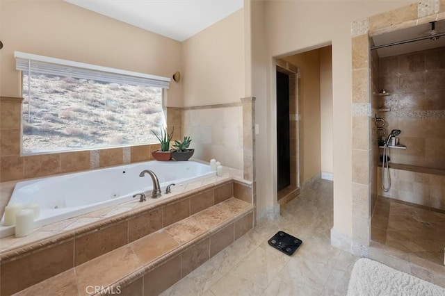 bathroom with tile patterned flooring and shower with separate bathtub