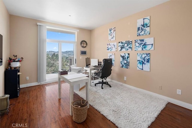 office featuring dark wood-type flooring and baseboards