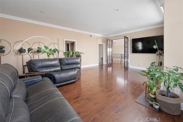 living room with ornamental molding and dark hardwood / wood-style floors