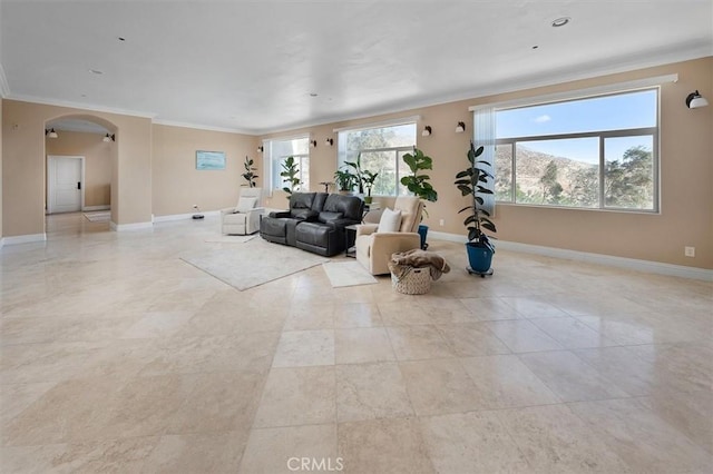 9455 Hierba Rd, Agua Dulce, CA 91390 - living area featuring arched walkways, ornamental molding, and light tile patterned flooring