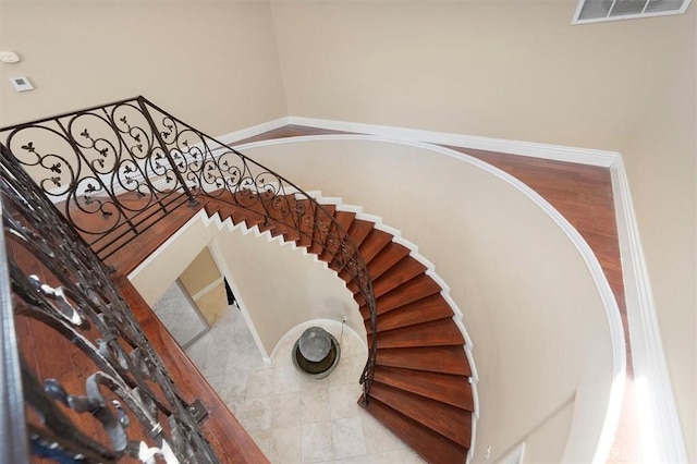 stairway featuring visible vents