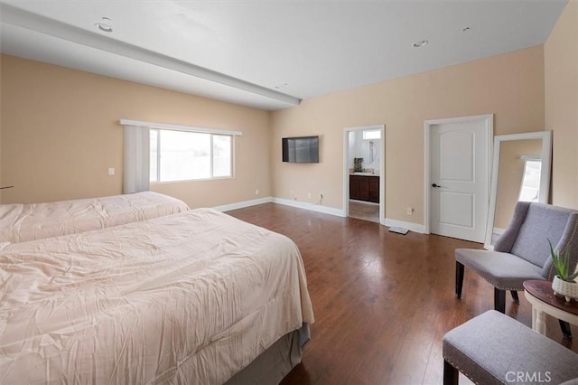 bedroom with dark wood-style floors and baseboards