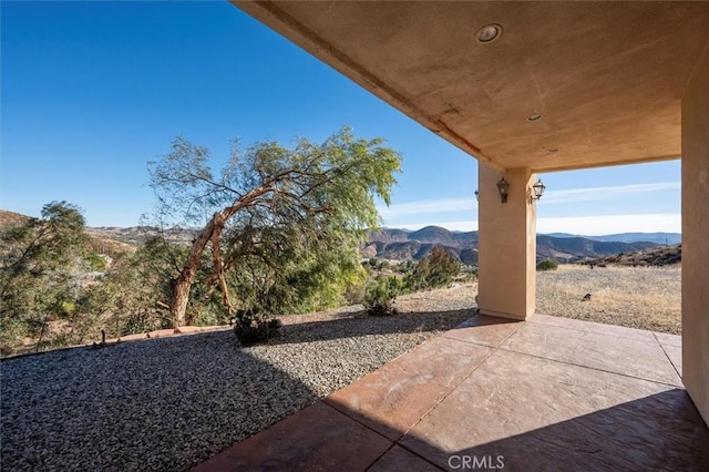 view of patio featuring a mountain view