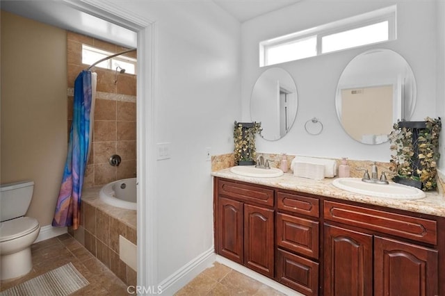 full bathroom with shower / tub combo with curtain, tile patterned floors, toilet, and vanity