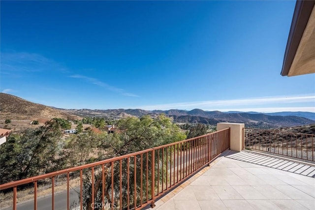 balcony featuring a mountain view