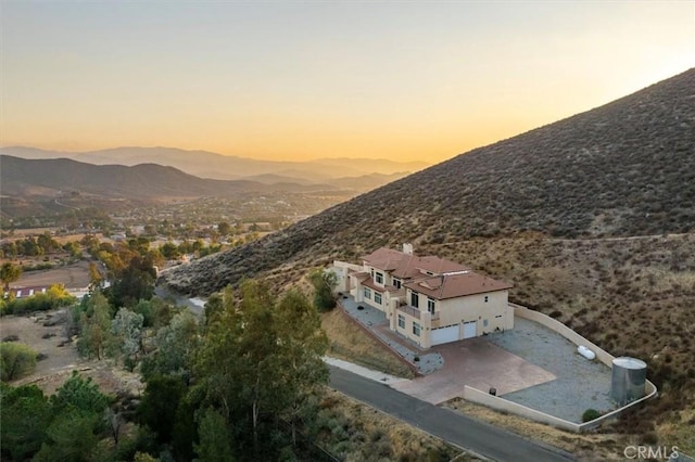 drone / aerial view featuring a mountain view