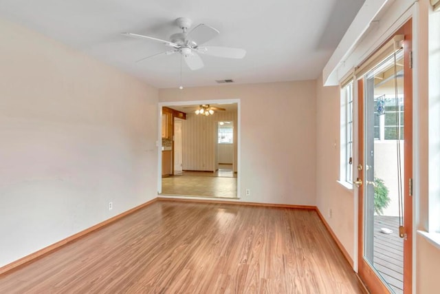 spare room featuring ceiling fan and light wood-type flooring