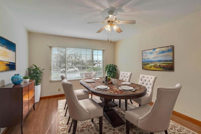 dining area featuring ceiling fan and light hardwood / wood-style floors