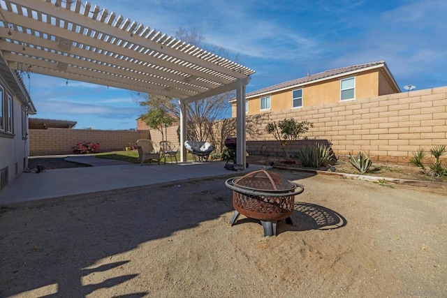 view of patio with an outdoor fire pit and a pergola