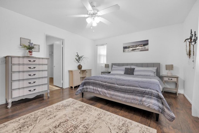 bedroom featuring dark hardwood / wood-style floors and ceiling fan