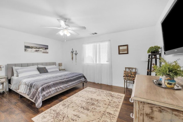 bedroom featuring dark hardwood / wood-style flooring and ceiling fan