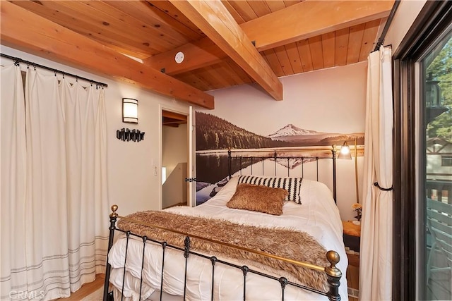 bedroom featuring wood ceiling and beam ceiling