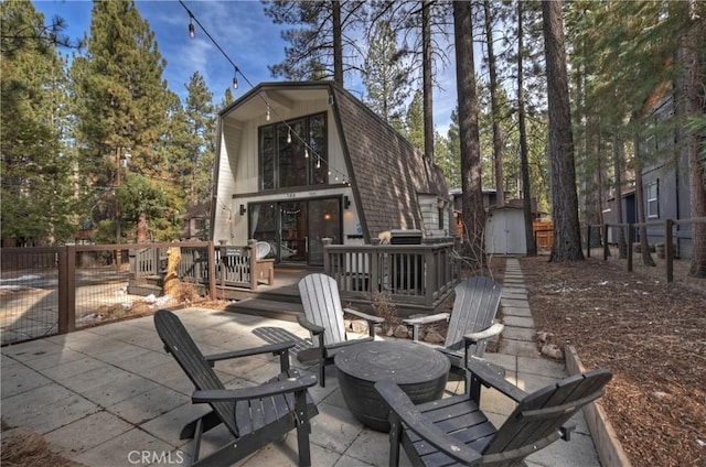 view of patio featuring a storage unit