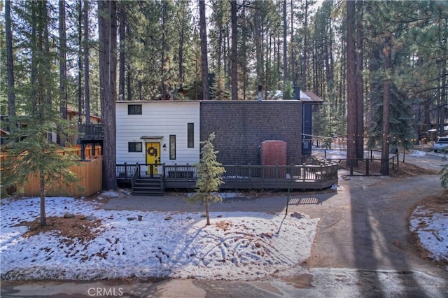 view of property featuring a wooden deck