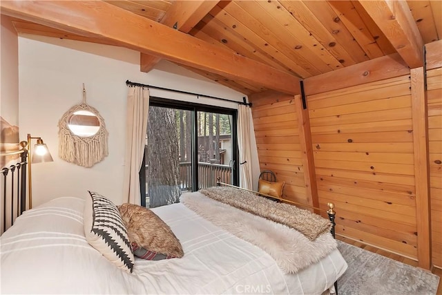 bedroom featuring vaulted ceiling with beams, wood walls, wood ceiling, and access to exterior