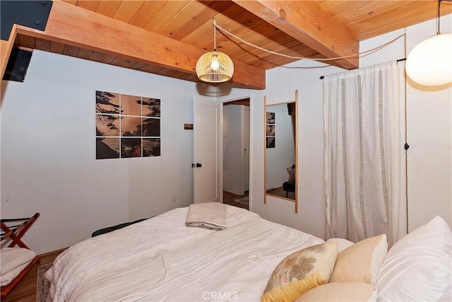 bedroom featuring beam ceiling and wooden ceiling