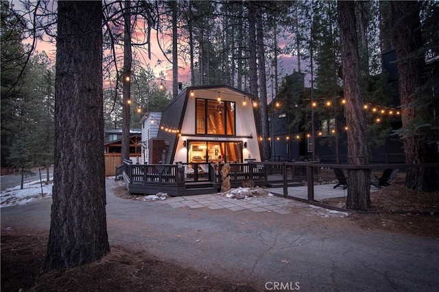 a-frame home featuring a deck