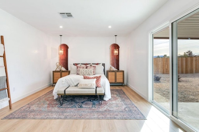 bedroom featuring access to outside and light wood-type flooring