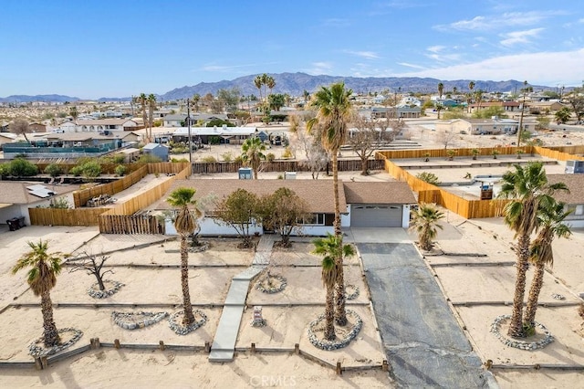 birds eye view of property with a mountain view