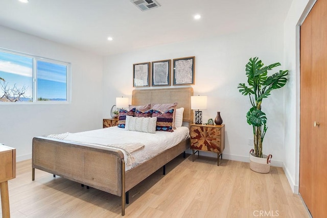 bedroom with light hardwood / wood-style floors