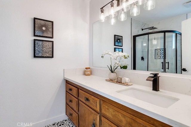 bathroom with vanity and a shower with shower door