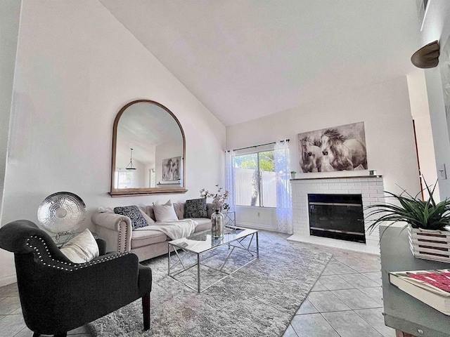 tiled living room featuring a brick fireplace and high vaulted ceiling