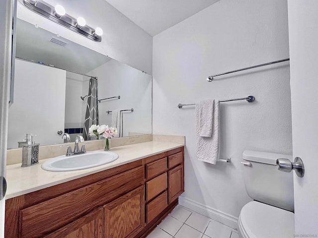 bathroom with walk in shower, tile patterned floors, toilet, and vanity