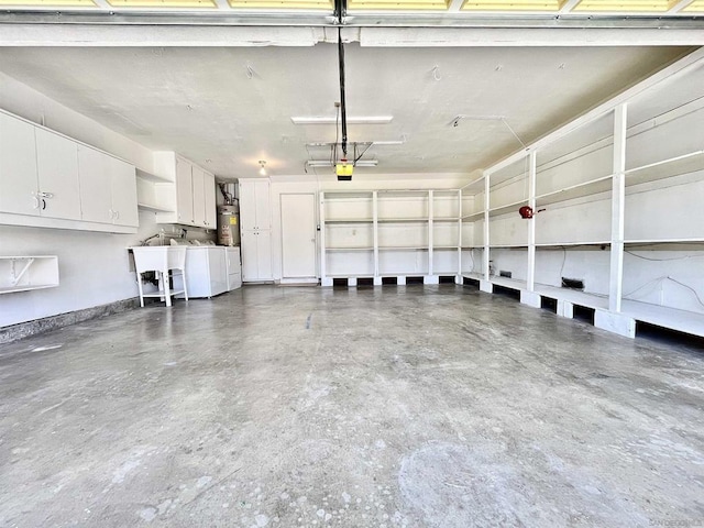 garage with washer and dryer, a garage door opener, and water heater