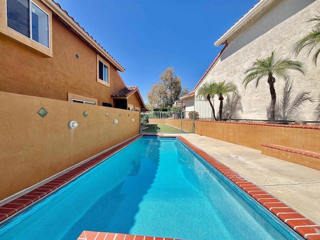 view of pool featuring a patio