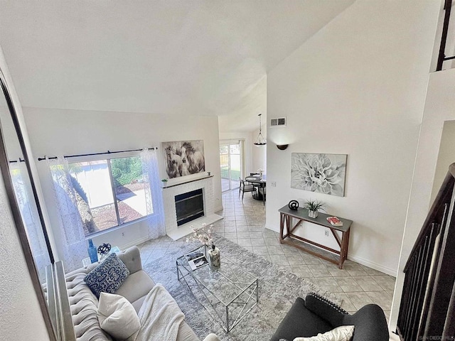 tiled living room with high vaulted ceiling