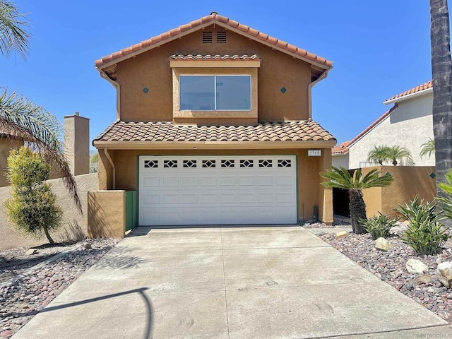 mediterranean / spanish-style house featuring a garage