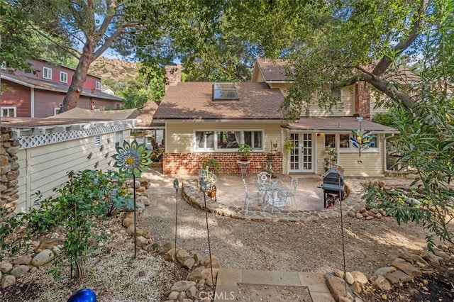 rear view of property with a patio area