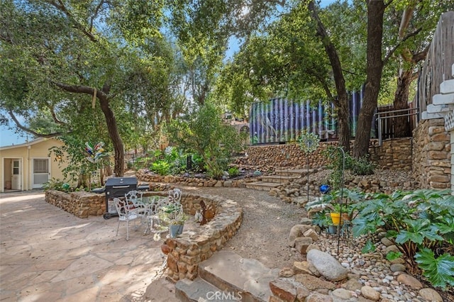 view of patio featuring a grill