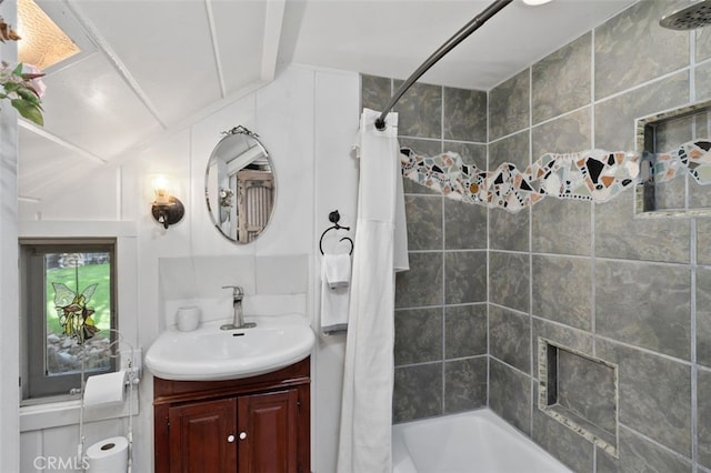 bathroom featuring vanity and shower / tub combo with curtain