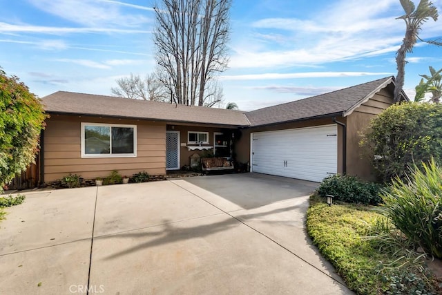 ranch-style home featuring a garage