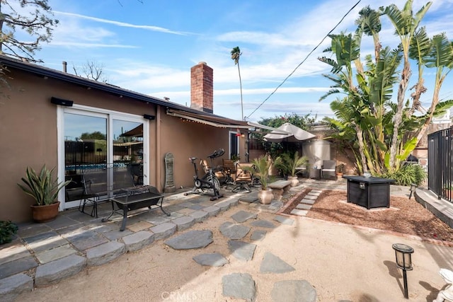 view of patio / terrace with an outdoor fire pit