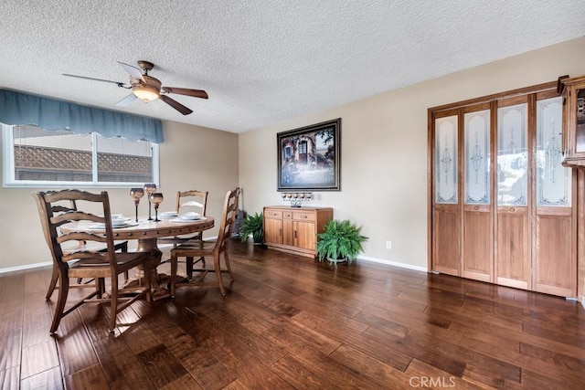 dining area featuring dark wood-type flooring, plenty of natural light, and a textured ceiling