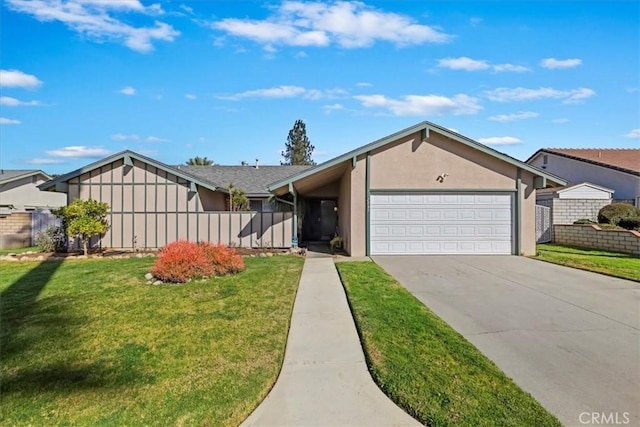 view of front of home featuring a garage and a front yard