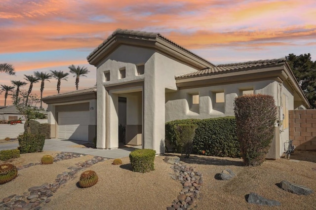 view of front of property featuring a garage