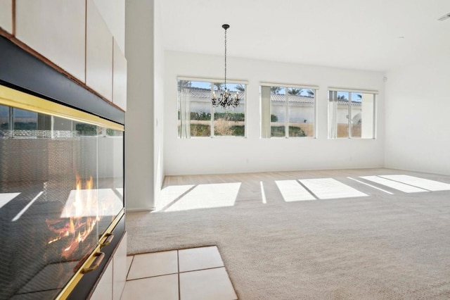 interior space with light colored carpet and a notable chandelier