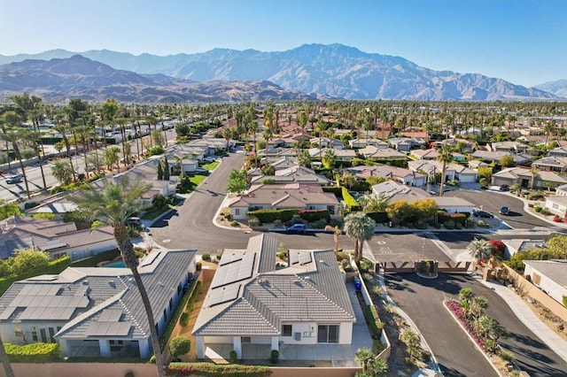 birds eye view of property featuring a mountain view