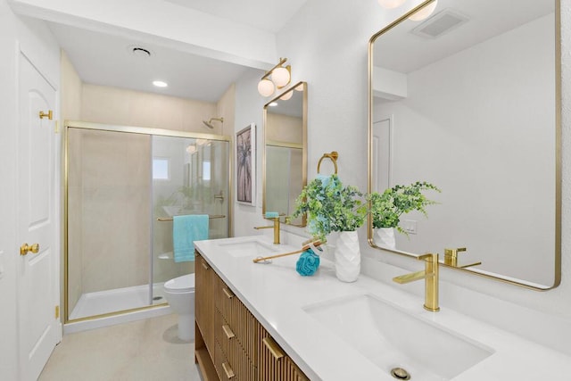 bathroom featuring vanity, an enclosed shower, and toilet