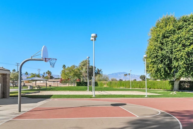 view of basketball court featuring a gazebo, a yard, and a mountain view