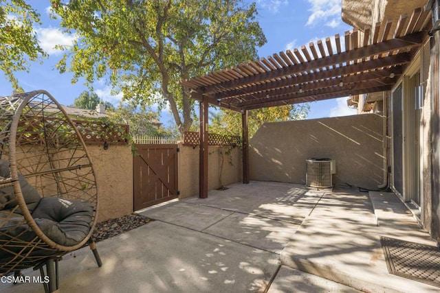 view of patio / terrace with central air condition unit and a pergola