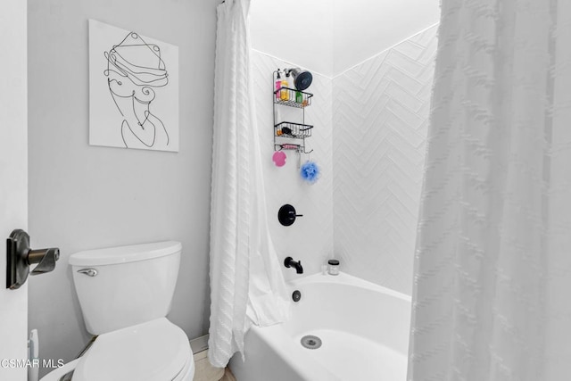 bathroom featuring toilet and shower / bath combo