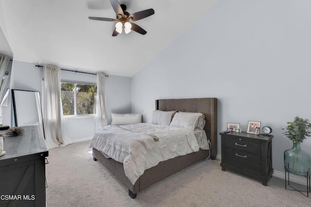 carpeted bedroom featuring lofted ceiling and ceiling fan