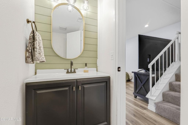 bathroom with vanity and wood-type flooring