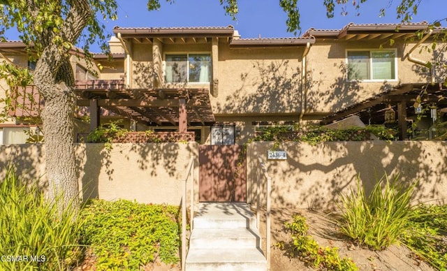 view of front of house featuring a pergola